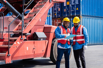 Fototapeta premium Two male engineers in a container shipping company Consulting to check the order for the container that is responsible