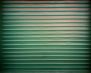 Closeup shot of a green corrugated metal garage door
