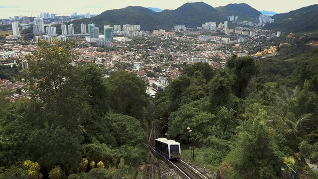 Funicular going to the top station in Penang Hill with George Town aerial view, Malaysia