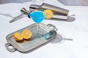 Blue lagoon cocktail served in a glass jar.