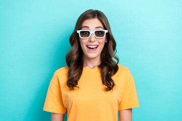 Closeup photo of young pretty nice cute woman open mouth wear glasses shocked unexpected movie moment isolated on cyan color background