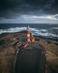 Vertical shot of a lighthouse on a gloomy day in Canary Islands