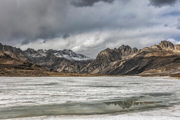 Outstanding view of Sister Lake against of backdrop of mountains at the cloudy day
