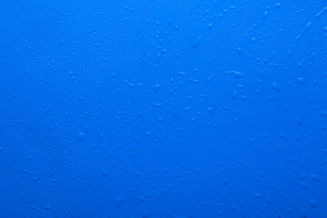 Water drops on blue color surface raindrops
