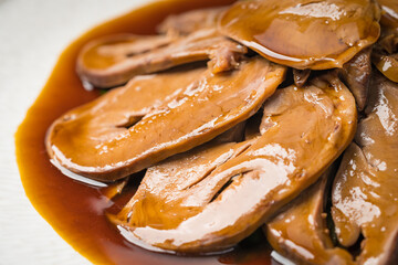 Special Chinese food braised pork heart on retro background