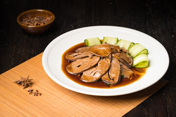 Special Chinese food braised pork heart on retro background