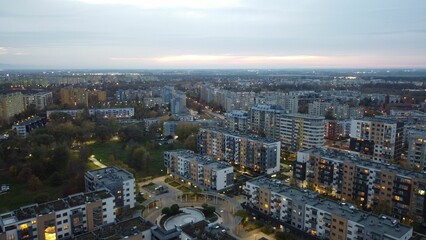 Obraz premium Aerial view of a city panorama of Wroclaw, Poland, during the sunset, with street lights turned on