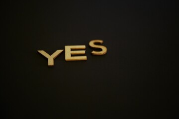 Bright yes text on a dark black background