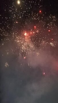 Colorful fireworks explode against the black night sky, beautiful fireworks party and looks festive with the beautiful colors of the fireworks