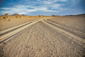 View of two roads separating in different directions in the Saudi desert