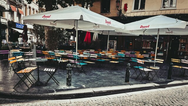 Cafe with colorful chairs and Duvel umbrellas in Angouleme