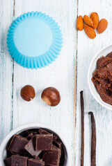 muffin baking ingredients on white wooden table
