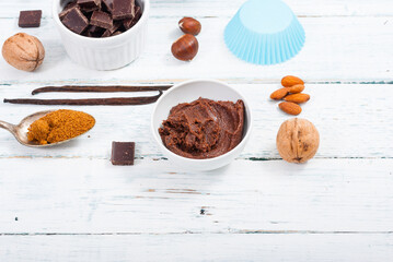 muffin baking ingredients on white wooden table