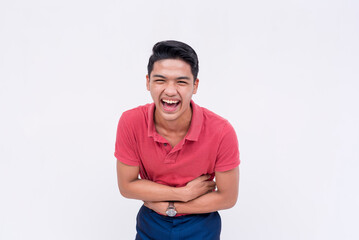 A young man bursting into a fit of laughter. A asian person having fun. Lighthearted scene isolated...