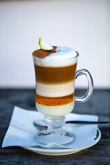 Vertical shot of a tasty glass of barraquito with liquor and milk