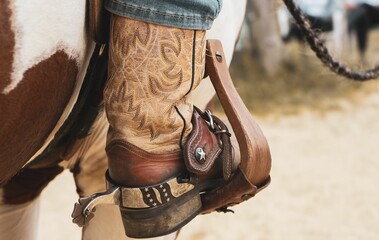 Beautiful close up shot of a cowgirls western boots