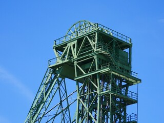 winding tower, upper part,  from a former coal mine on the lower Rhine river area.  The steel frame and the huge cable winches with which the cables of the hoisting cage were moved can be seen