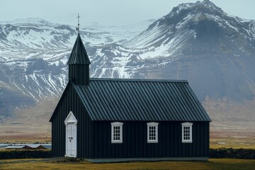 Budir black church before the mountains in Iceland