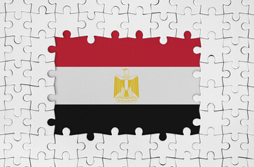Egypt flag in frame of white puzzle pieces with missing central part