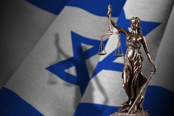 Israel flag with statue of lady justice and judicial scales in dark room. Concept of judgement and...
