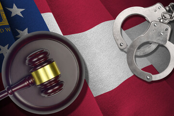 Georgia US state flag with judge mallet and handcuffs in dark room. Concept of criminal and...