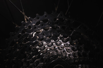 Used bike cassette on black background