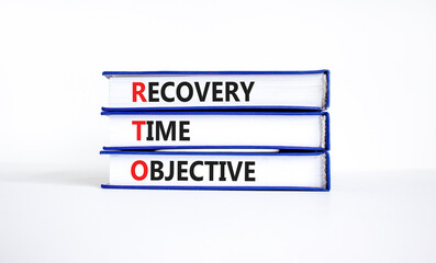 RTO recovery time objective symbol. Concept words RTO recovery time objective on books on a...