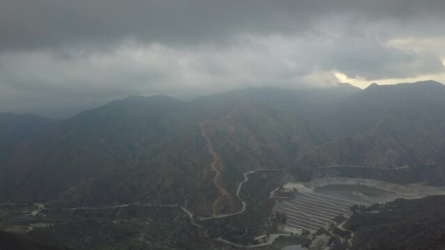 Aerial view of misty mountains and cloudy sky. Glendora, California, USA.