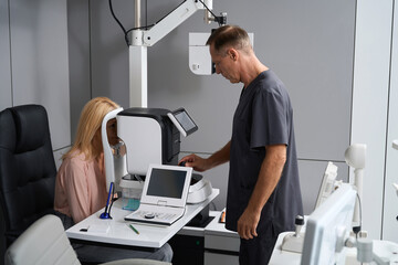 Fototapeta premium Woman is having diagnostics in ophthalmological clinic