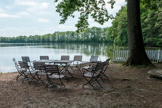 Table with chairs on the lake shore