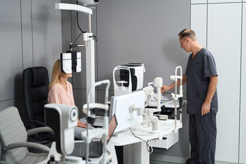 Young woman sitting and having examination in clinic