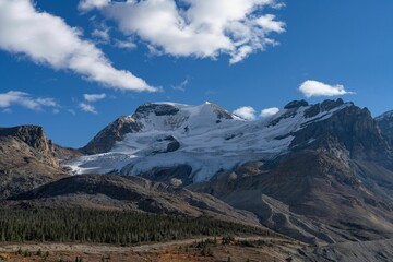 Beautiful shot of rough mountains covered in snow in the daytime