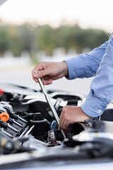 Man with checking car engine.