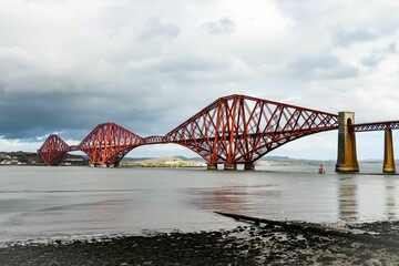 Scenic view of Forth Bridge in the United Kingdom in cloudy sky background