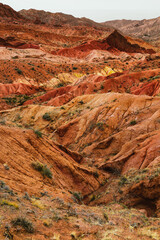 Fairytale Canyon in Kyrgyzstan. Bizarre rock formations, fairy tale valley, unusual colored rocks, sandstone erosion. Southern shore of Lake Issyk-Kul, near Karakol City. Terskey Ala-Too mountains.