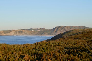 Beautiful view of the sea near the mountains in Aviles, Spain