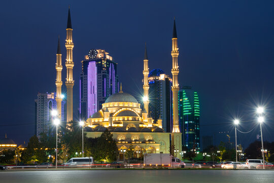 GROZNY, RUSSIA - SEPTEMBER 29, 2021: Mosque "Heart of Chechnya" mosque against the background of the business center of "Grozny City" on a September night