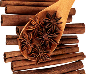 Cinnamon sticks and stars anise isolated on white