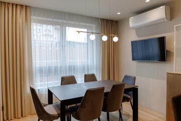 dining table in the living room near the large window