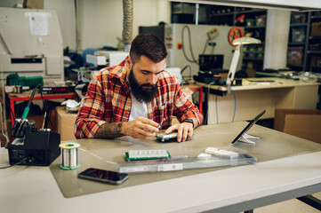 Electronics engineer working in a professional workshop