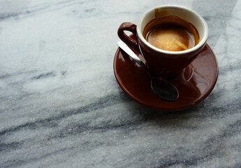 cup of coffee and a mug of hot chocolate on a white wooden background.