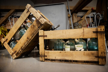 old bottles in wooden boxes
