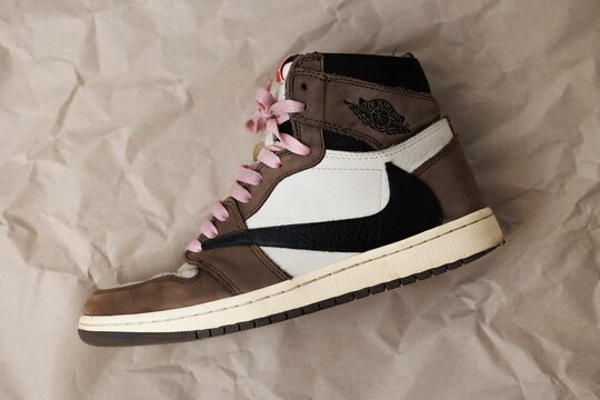 Closeup of Nike Air Jordan 1 High 'Travis Scott' with pink shoe laces.