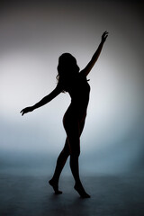 dancing silhouette of slim girl