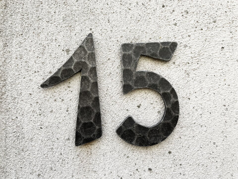 15 - house number fifteen on wall