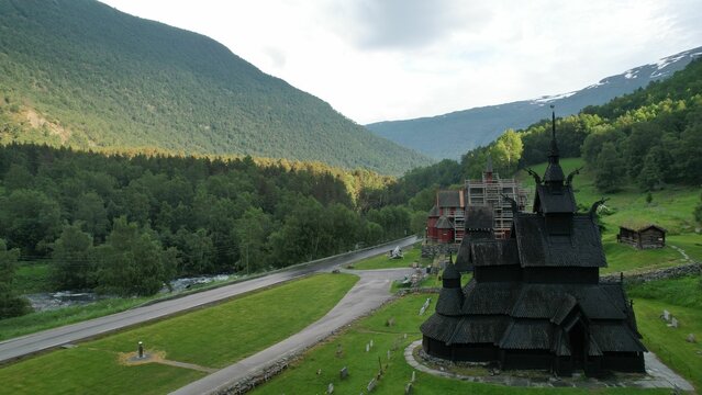 Scenic shot of the Borgund Stave Church against the green hills in Norway