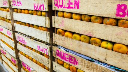 wooden boxes of oranges fruit. ready to deliver over province