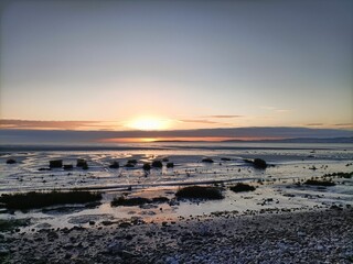 Fototapeta na wymiar Scenic view of a beautiful sunset seen on the horizon of a beach