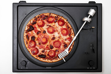 Pizza Pepperoni on a vintage turntable with the needle arm working