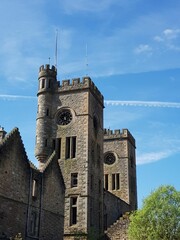 Twin towers of Hartwood Hospital against a blue cloudy sky